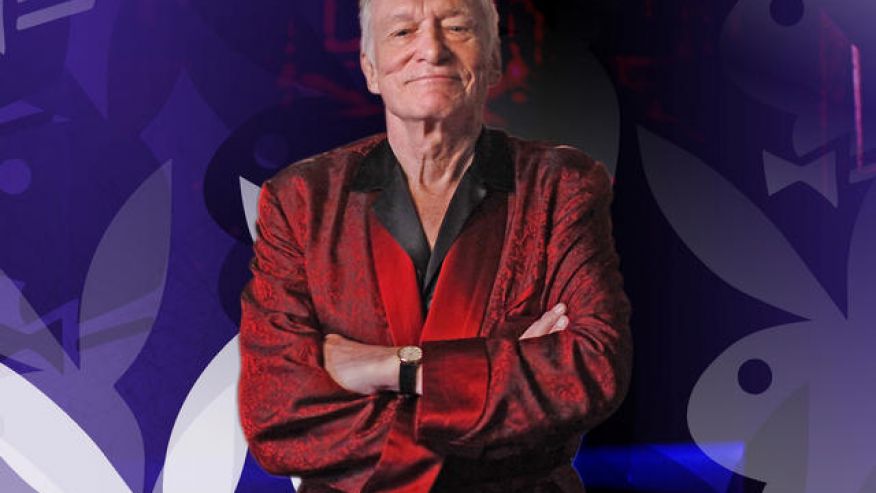 Playboy magazine founder Hugh Hefner poses for photos at the Playboy Mansion in Los Angeles
